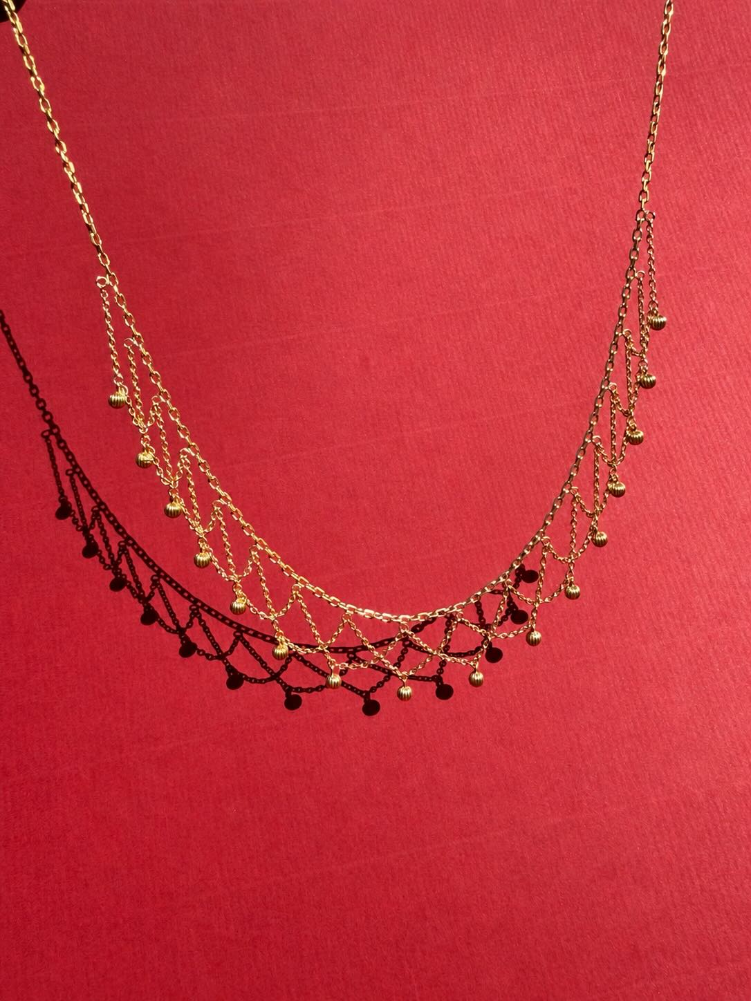 Collier draperie à godrons